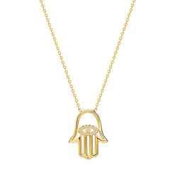 Make a powerful statement with the Diamond Hamsa Pendant. This 14 karat gold pendant is an eye-catcher as it brilliant cut diamonds shine brightly. The center of the pendant features an evil eye with handset diamond pave. 