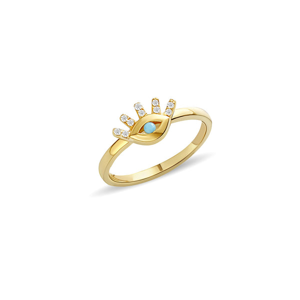 This 14 karat gold diamond ring is our dream jewelry piece. The turquoise stone in the center of the eye is encased with pave set diamond lashes. A magical gold ring that lasts a lifetime.