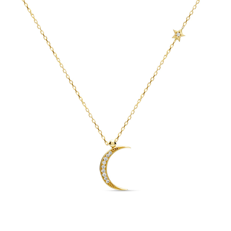 A magical 14 karat gold diamond necklace that will become your day to night companion. Moon magic diamond gold necklace.
