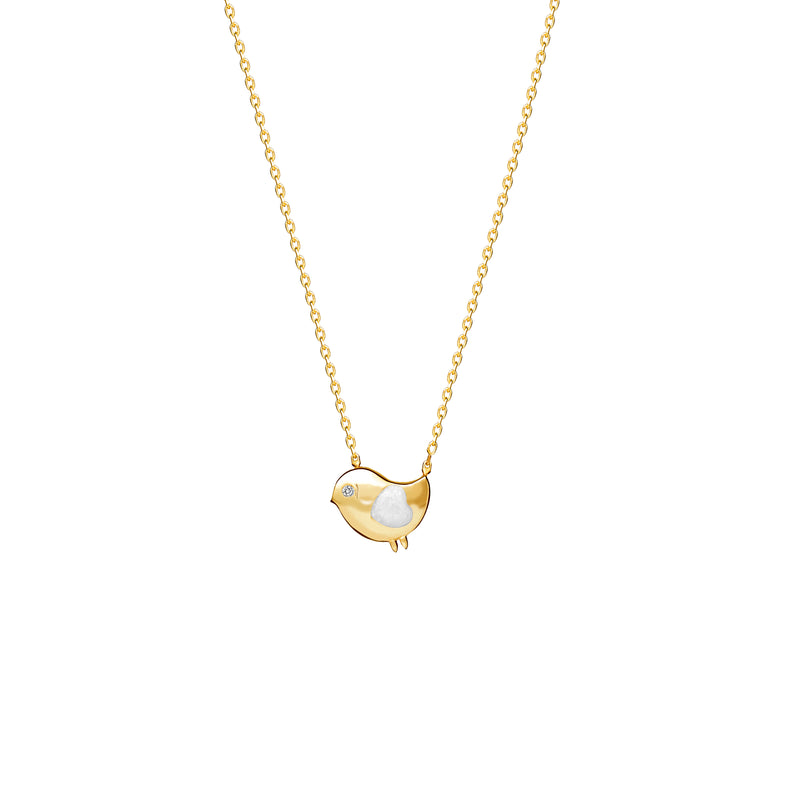 Our 14 karat gold necklace for girls. This adorable bird necklace features pearl enamel hand-painting and a diamond eye that will make her sparkle.