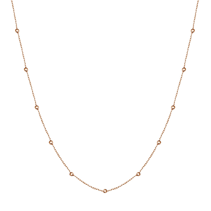 This ball chain necklace in 14 karat gold features petit balls aligned along the gold chain. Wear it by itself or combine with other gold necklaces for the ultimate layering look.