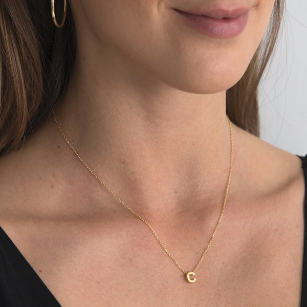 A 18 karat gold vermeil necklace with your initial letter "C". This diamond letter necklace is a special jewelry necklace that can be worn day and night. A genuine diamond stone in the corner of the letter makes this gold diamond necklace a luxury and ideal gift for yourself, your best friend or loved one.
