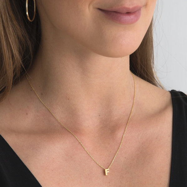 A 18 karat gold vermeil necklace with your initial letter "F". This diamond letter necklace is a special jewelry necklace that can be worn day and night. A genuine diamond stone in the corner of the letter makes this gold diamond necklace a luxury and ideal gift for yourself, your best friend or loved one.