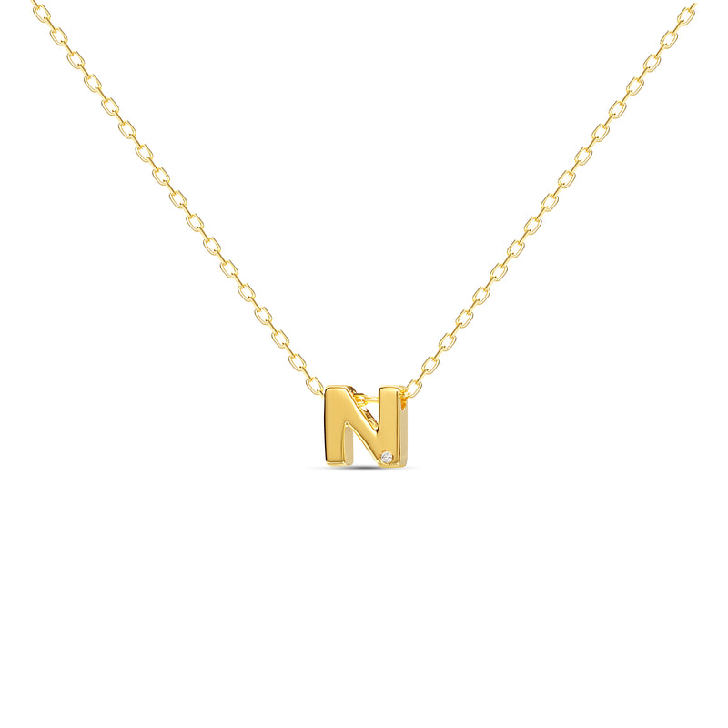 A 18 karat gold vermeil necklace with your initial letter "N". This diamond letter necklace is a special jewelry necklace that can be worn day and night. A genuine diamond stone in the corner of the letter makes this gold diamond necklace a luxury and ideal gift for yourself, your best friend or loved one. 