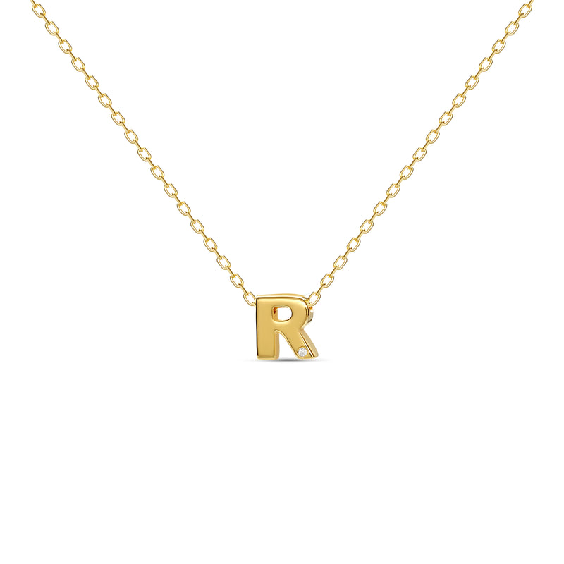 A 18 karat gold vermeil necklace with your initial letter "R". This diamond letter necklace is a special jewelry necklace that can be worn day and night. A genuine diamond stone in the corner of the letter makes this gold diamond necklace a luxury and ideal gift for yourself, your best friend or loved one. 